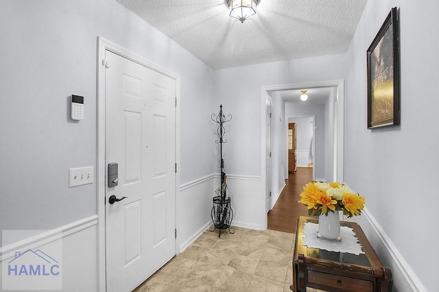 209 Chandra Way, Hinesville, GA 31313 - entryway featuring a textured ceiling and baseboards