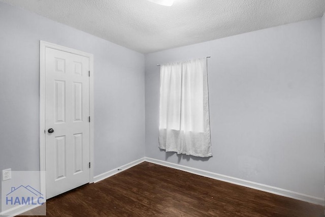 209 Chandra Way, Hinesville, GA 31313 - empty room with wood finished floors, baseboards, and a textured ceiling