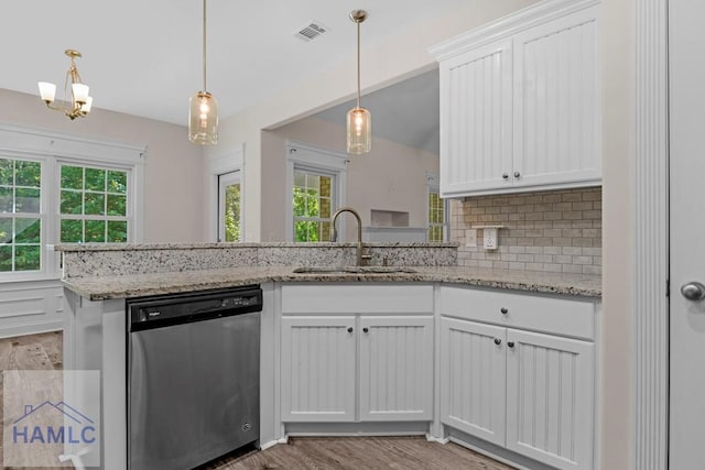 791 Stafford Dairy Rd SE, Ludowici, GA 31316 - kitchen with dishwasher, a sink, tasteful backsplash, and plenty of natural light