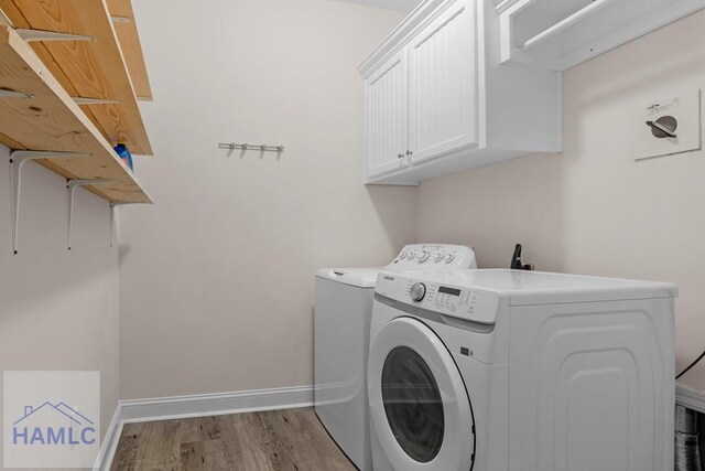 791 Stafford Dairy Rd SE, Ludowici, GA 31316 - washroom featuring independent washer and dryer, wood finished floors, cabinet space, and baseboards