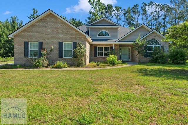 791 Stafford Dairy Rd SE, Ludowici, GA 31316 - view of front of house with brick siding and a front yard