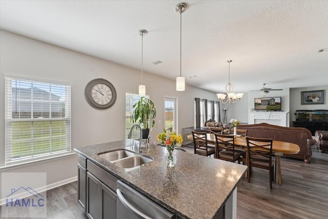 263NE Summer Hill Dr, Ludowici, GA 31316 - kitchen with a sink, stainless steel dishwasher, open floor plan, dark wood-style flooring, and a chandelier