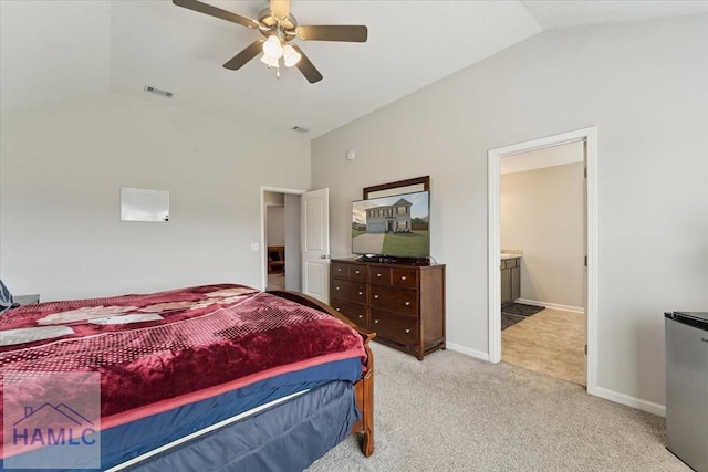 263NE Summer Hill Dr, Ludowici, GA 31316 - bedroom featuring vaulted ceiling, light carpet, ceiling fan, baseboards, and connected bathroom