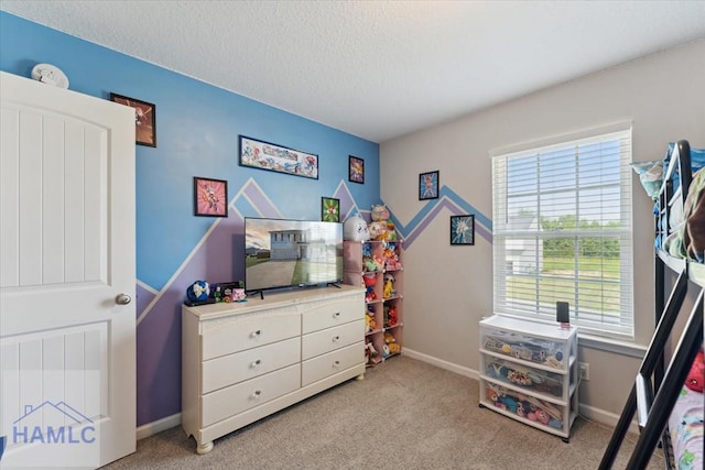 263NE Summer Hill Dr, Ludowici, GA 31316 - rec room featuring light colored carpet, a textured ceiling, and baseboards