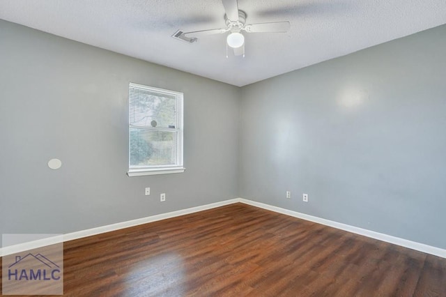 empty room with hardwood / wood-style flooring, ceiling fan, and a textured ceiling