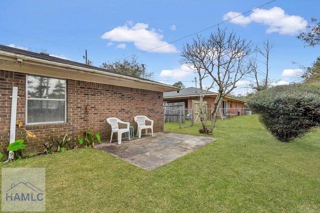 back of property featuring a lawn and a patio