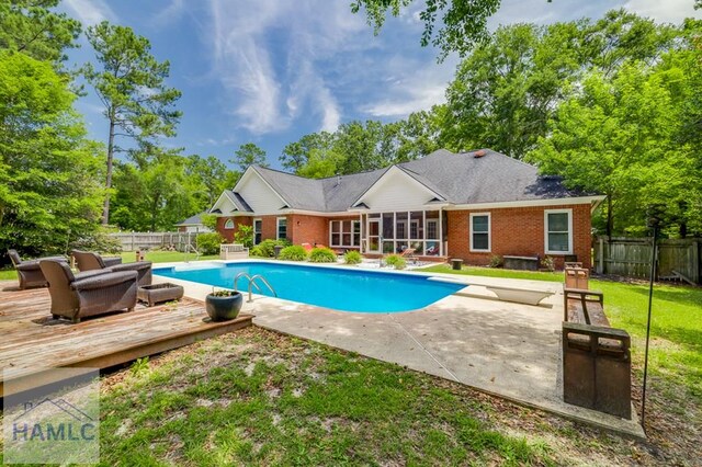 202 Red Bluff Cir, Rincon, GA 31326 - view of swimming pool with a deck, a fenced backyard, a diving board, a sunroom, and a patio