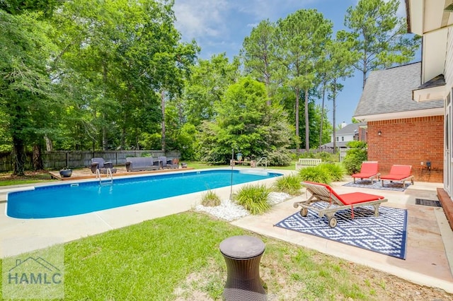 202 Red Bluff Cir, Rincon, GA 31326 - view of swimming pool featuring a patio, a fenced backyard, and view of wooded area
