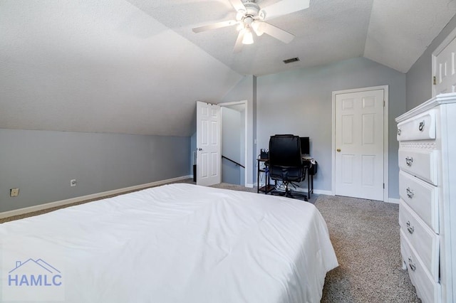 202 Red Bluff Cir, Rincon, GA 31326 - carpeted bedroom with vaulted ceiling, a textured ceiling, and ceiling fan
