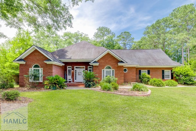 202 Red Bluff Cir, Rincon, GA 31326 - single story home featuring brick siding, a front yard, and roof with shingles