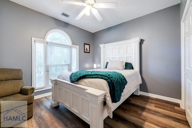 202 Red Bluff Cir, Rincon, GA 31326 - bedroom featuring dark wood finished floors, a ceiling fan, and a textured ceiling