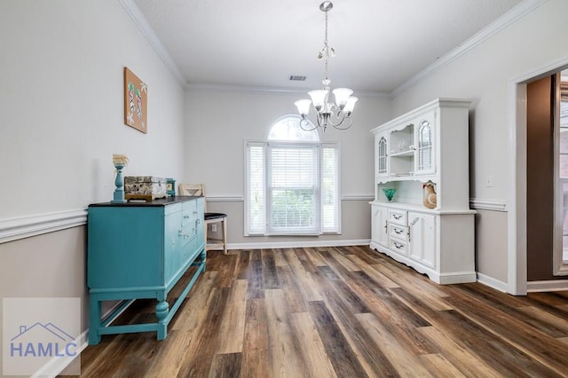 202 Red Bluff Cir, Rincon, GA 31326 - dining area with dark wood-style flooring, a chandelier, and ornamental molding