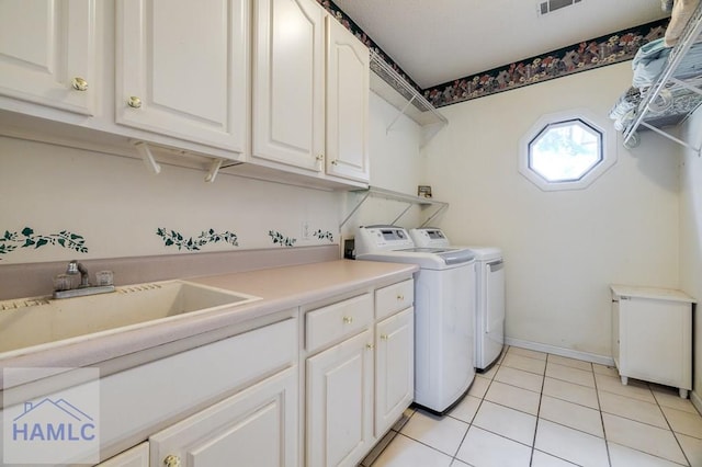 202 Red Bluff Cir, Rincon, GA 31326 - laundry room featuring cabinet space, washing machine and clothes dryer, and light tile patterned flooring