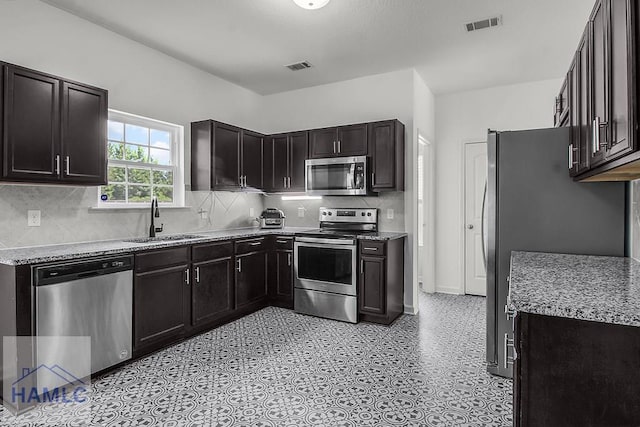 134 Dove Run Dr NE, Ludowici, GA 31316 - kitchen with appliances with stainless steel finishes and tasteful backsplash