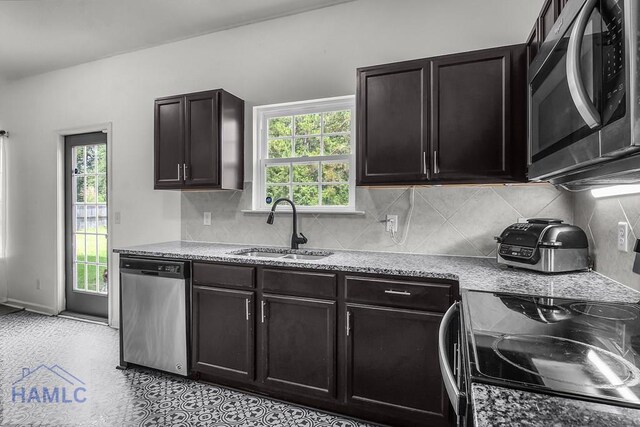 134 Dove Run Dr NE, Ludowici, GA 31316 - kitchen featuring stainless steel dishwasher, black / electric stove, healthy amount of natural light, and backsplash