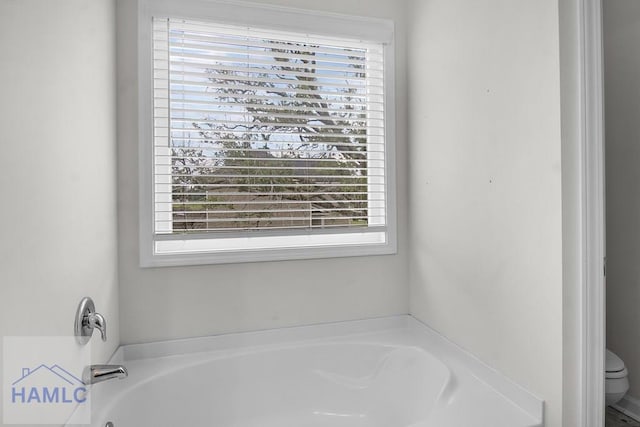 134 Dove Run Dr NE, Ludowici, GA 31316 - bathroom featuring healthy amount of natural light and a bath