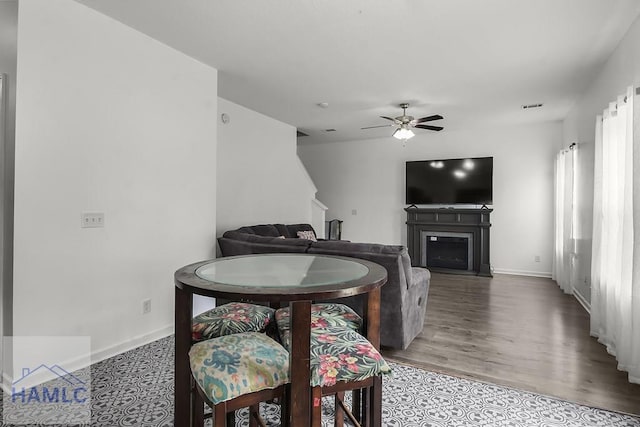 134 Dove Run Dr NE, Ludowici, GA 31316 - dining area featuring ceiling fan, a fireplace, and wood finished floors