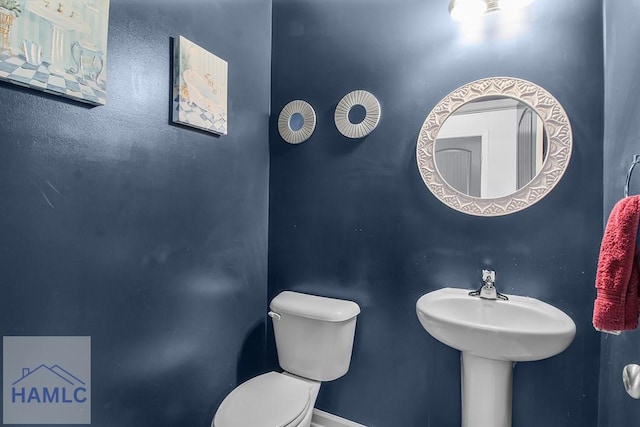 134 Dove Run Dr NE, Ludowici, GA 31316 - half bathroom with toilet and baseboards