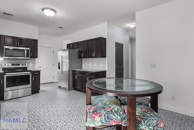 134 Dove Run Dr NE, Ludowici, GA 31316 - kitchen featuring stainless steel appliances and baseboards