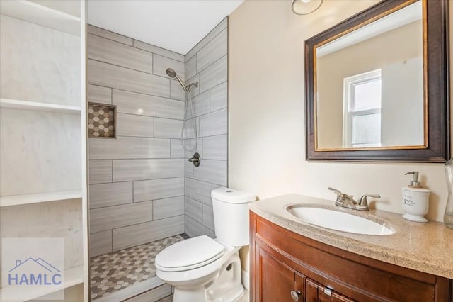 1019 Bacon Rd, Hinesville, GA 31313 - bathroom with vanity, tiled shower, and toilet