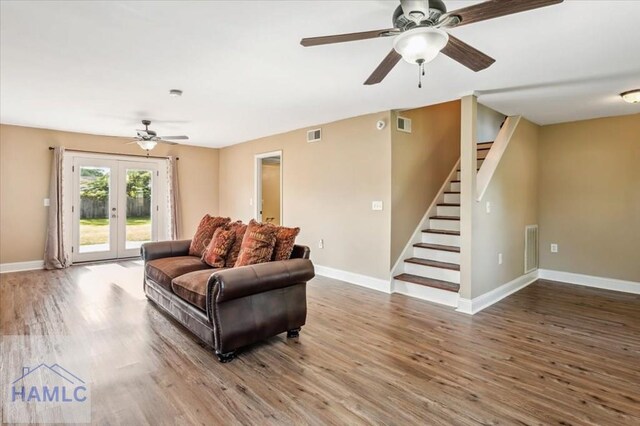 1019 Bacon Rd, Hinesville, GA 31313 - living area with a ceiling fan, wood finished floors, stairway, and french doors