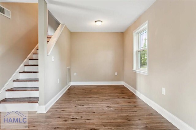 1019 Bacon Rd, Hinesville, GA 31313 - stairs featuring wood finished floors and baseboards