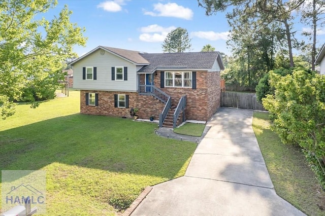 1019 Bacon Rd, Hinesville, GA 31313 - split level home featuring driveway and brick siding