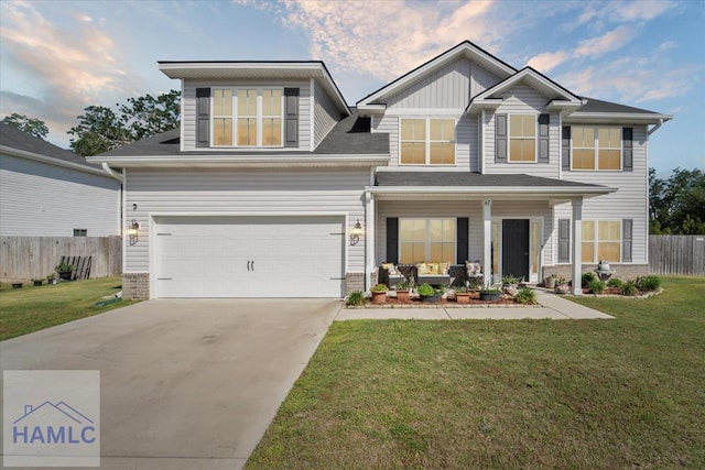 craftsman house featuring a porch, an attached garage, fence, and a front yard