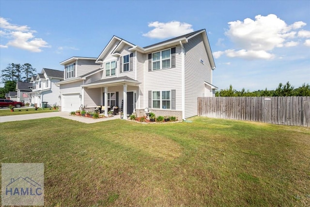 view of front facade featuring an attached garage, fence, driveway, and a front yard