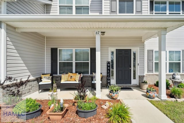 entrance to property featuring a porch
