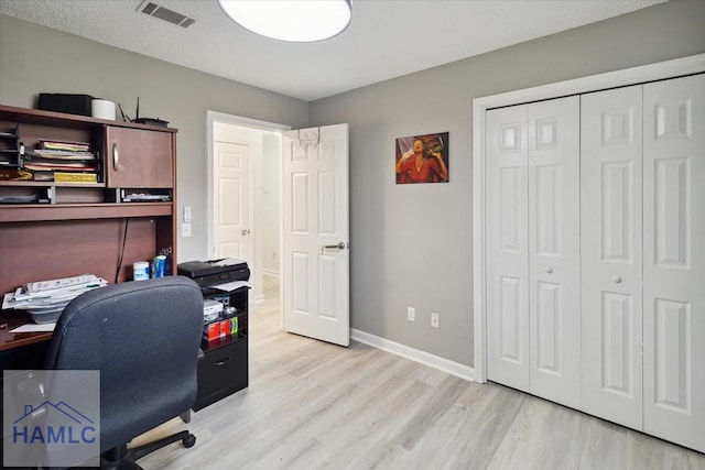 office area with light wood-type flooring