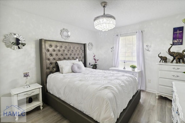 bedroom featuring wood-type flooring