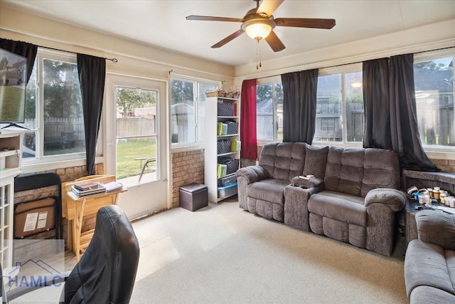 sunroom featuring ceiling fan