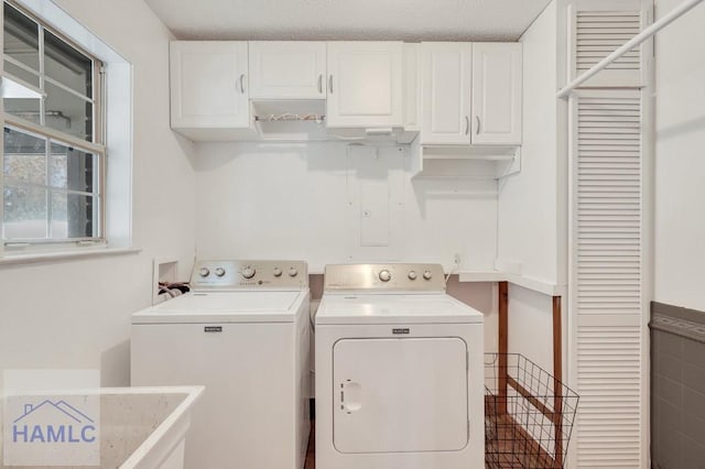 laundry area with cabinets and independent washer and dryer