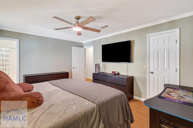 bedroom with crown molding, ceiling fan, and light hardwood / wood-style floors