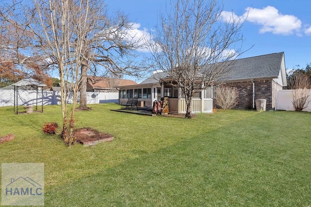 view of yard with a sunroom