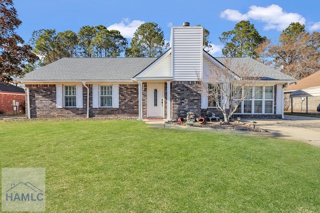 view of front of property with a front lawn and a carport