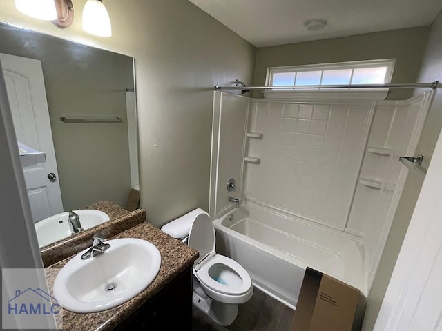 full bathroom with vanity, shower / bathtub combination, and toilet