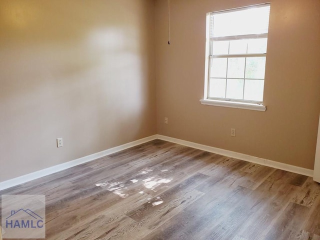 spare room featuring hardwood / wood-style floors