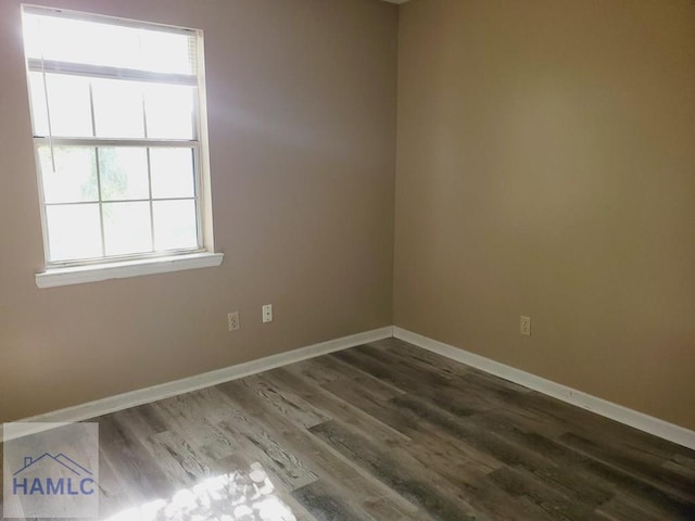 unfurnished room featuring dark hardwood / wood-style floors