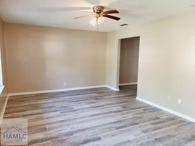 unfurnished room featuring ceiling fan and light hardwood / wood-style flooring