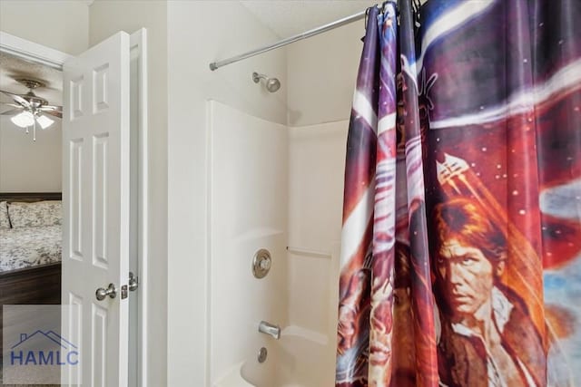128 W Kenny Dr, Hinesville, GA 31313 - bathroom featuring shower / bath combo with shower curtain, a ceiling fan, wood finished floors, and a textured ceiling