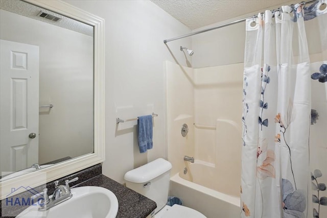 128 W Kenny Dr, Hinesville, GA 31313 - bathroom with vanity, a textured ceiling, and shower / bath combo