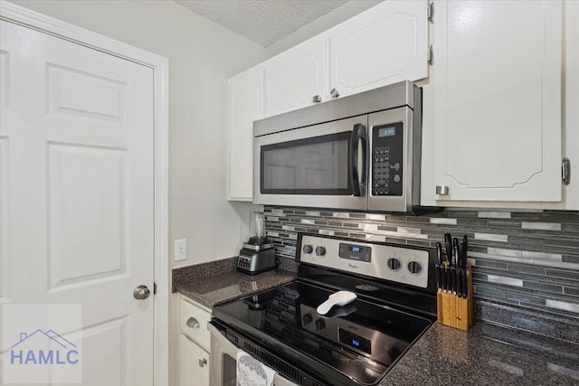 128 W Kenny Dr, Hinesville, GA 31313 - kitchen featuring appliances with stainless steel finishes, white cabinets, backsplash, and a textured ceiling