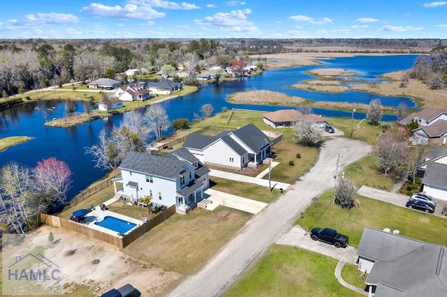 aerial view with a residential view and a water view