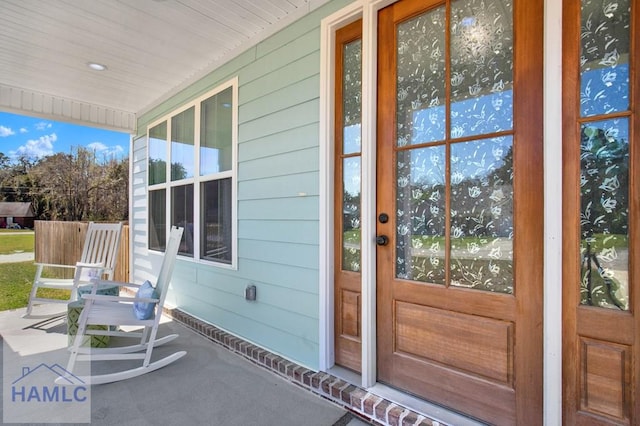 entrance to property with a porch