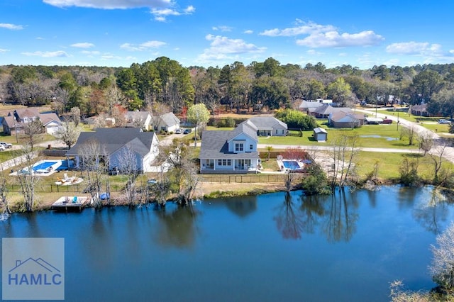 birds eye view of property with a water view