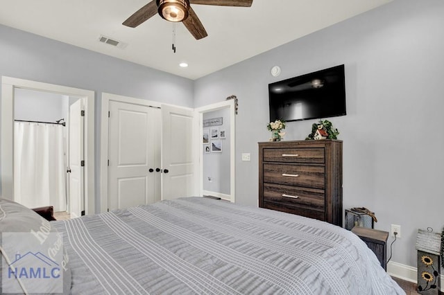 bedroom with baseboards, visible vents, a closet, and ceiling fan