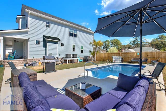 view of swimming pool featuring grilling area, fence, and an outdoor hangout area