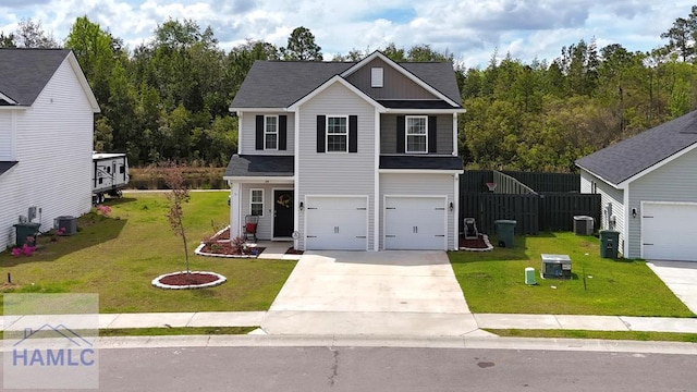 traditional-style home with concrete driveway, a garage, a front lawn, and central AC